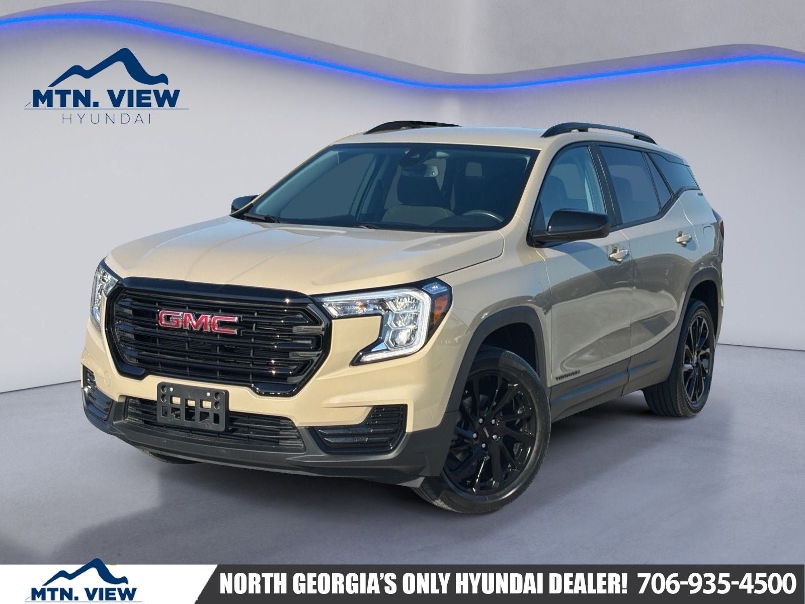 2023 GMC Terrain SLE in Desert Sand Metallic — front three-quarter view