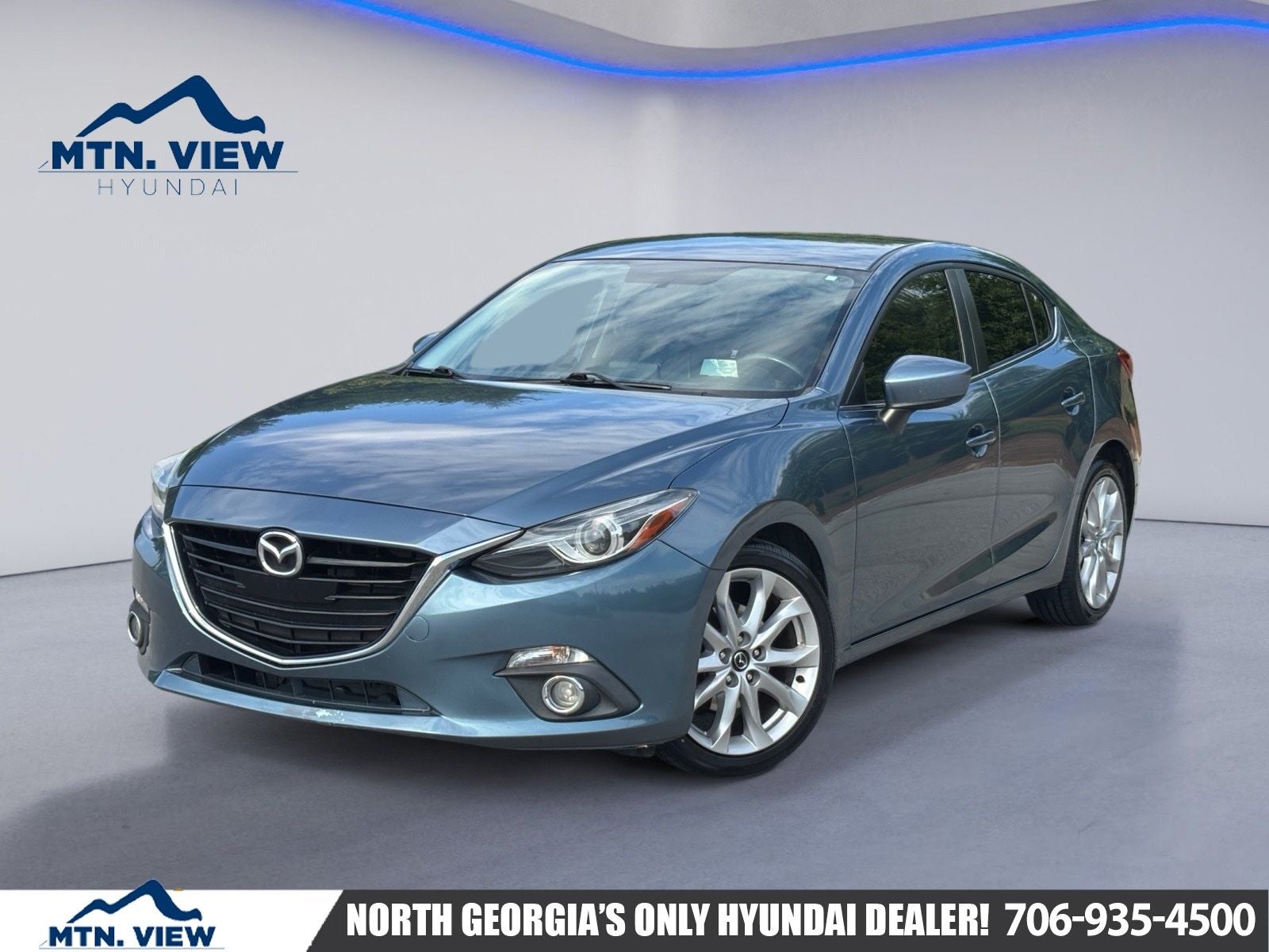 2014 Mazda Mazda3 s Touring in Blue Reflex Mica — front three-quarter view